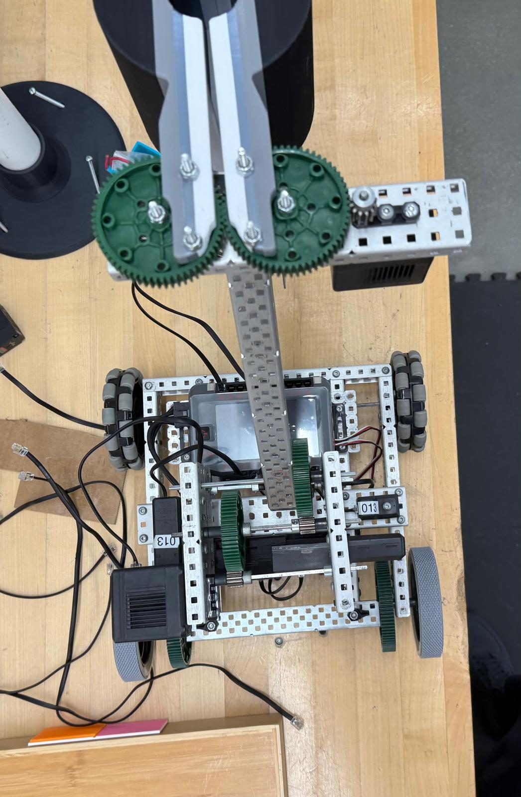 Top-down view of the VEX robot showing the gear-driven arm